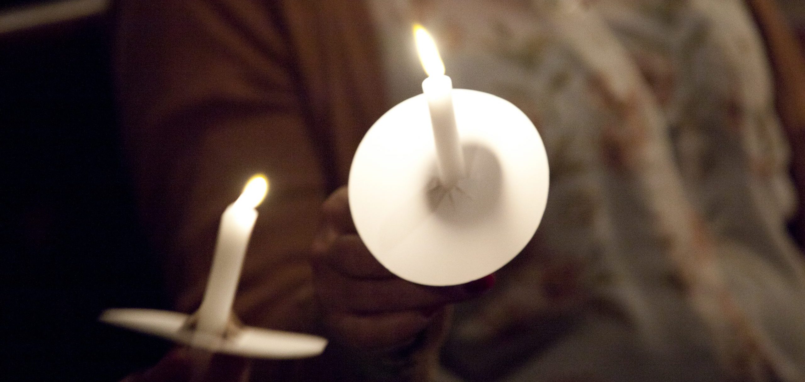 Lighting candles at the Carol Service